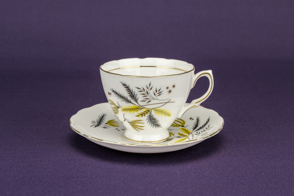 2 yellow teacups and saucers