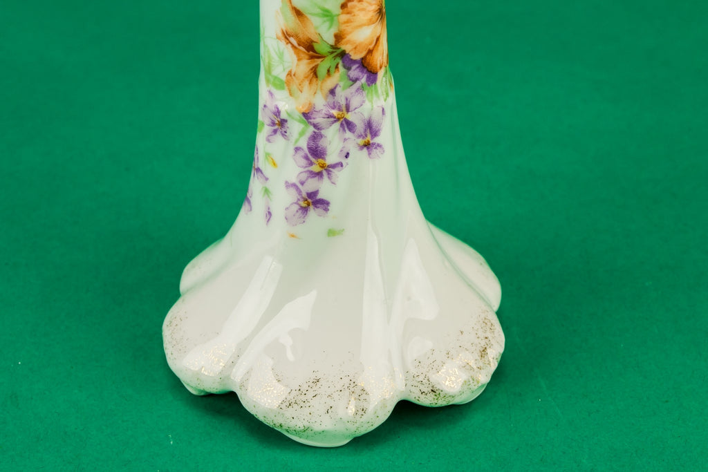 2 white floral candlesticks