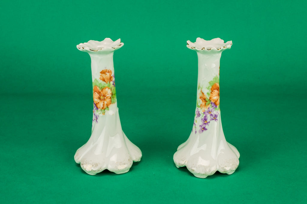 2 white floral candlesticks