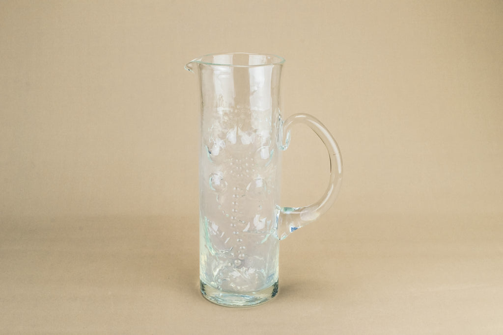Tall glass water jug