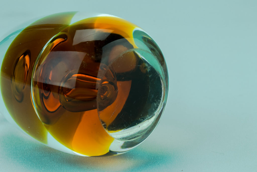 Amber glass egg paperweight