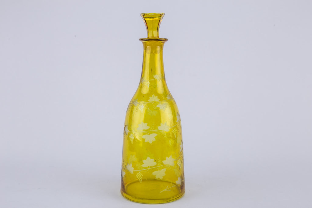 2 yellow glass wine bottles