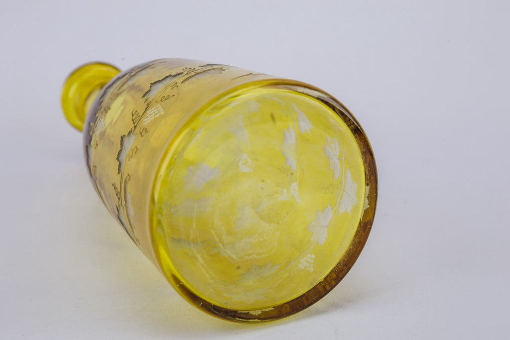 2 yellow glass wine bottles