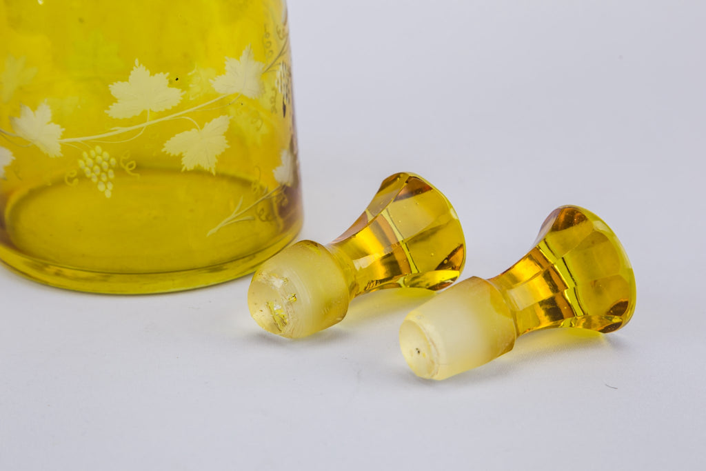 2 yellow glass wine bottles