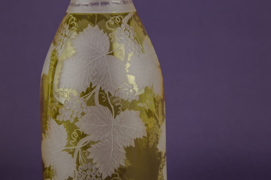 2 yellow glass wine bottles