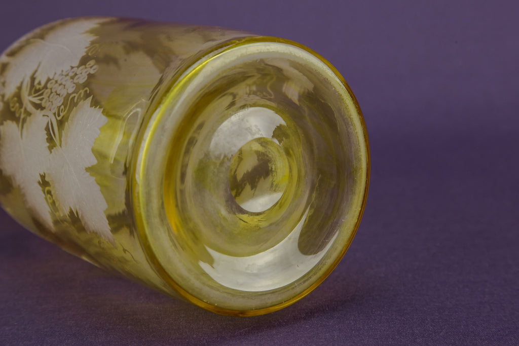 2 yellow glass wine bottles