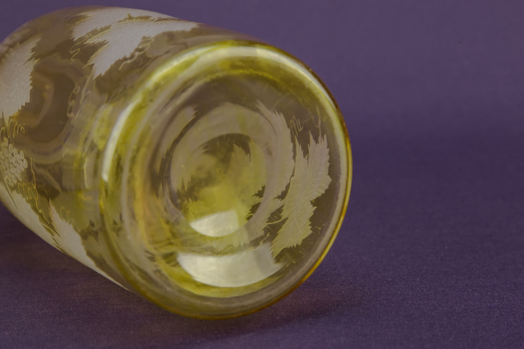2 yellow glass wine bottles