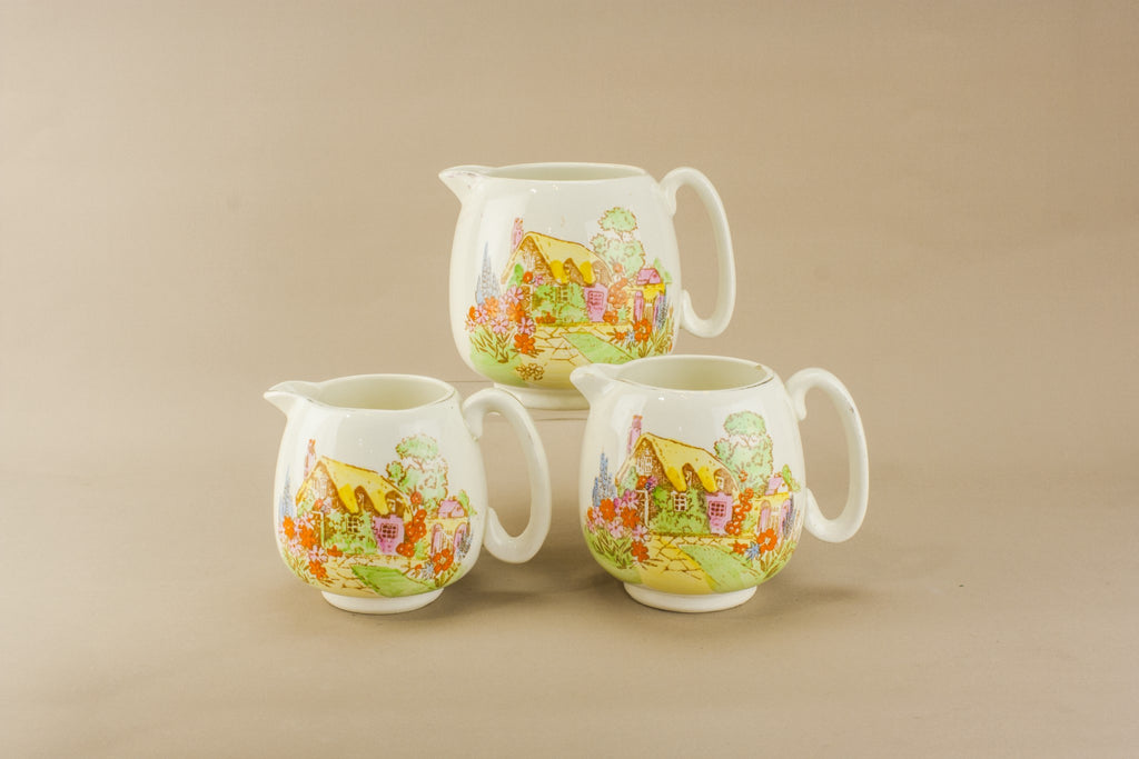 Three yellow pottery jugs