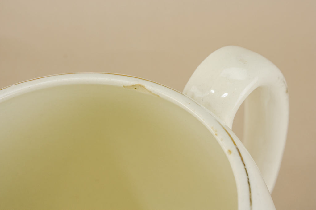 Three yellow pottery jugs