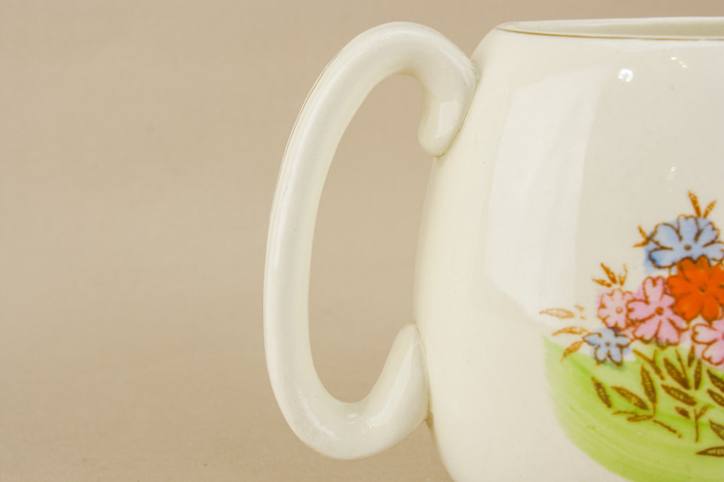 Three yellow pottery jugs