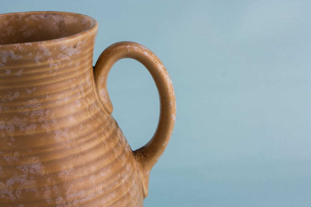 Orange pottery jug