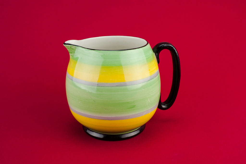 Yellow pottery creamer