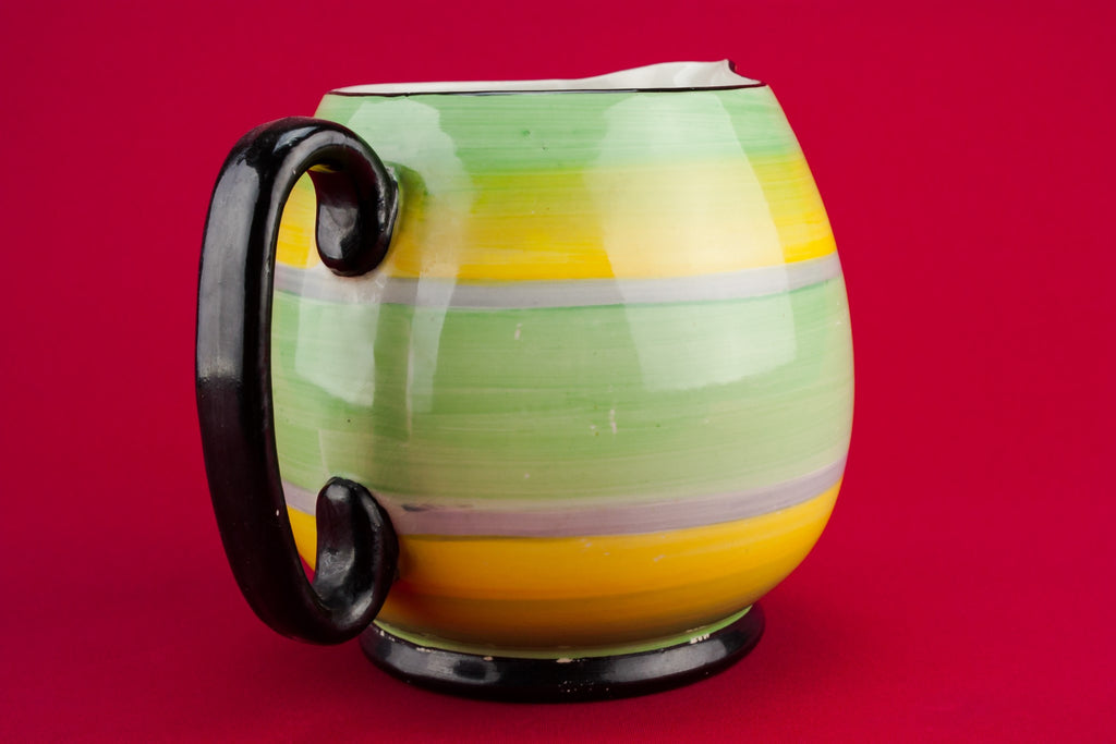 Yellow pottery creamer