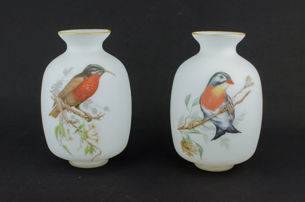 2 white glass vases