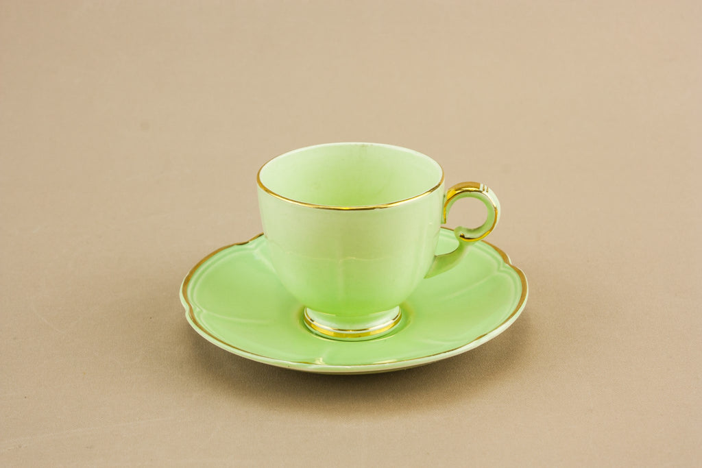 Green teacup and saucer