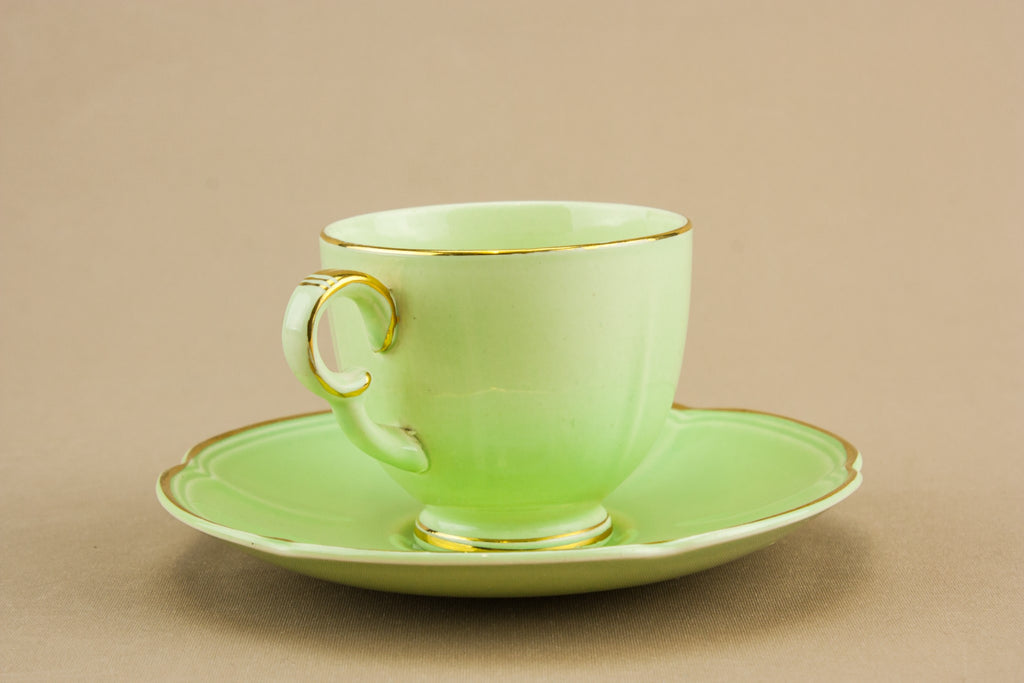Green teacup and saucer