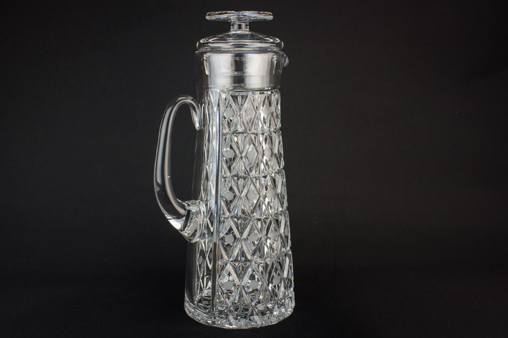 Tall glass water jug