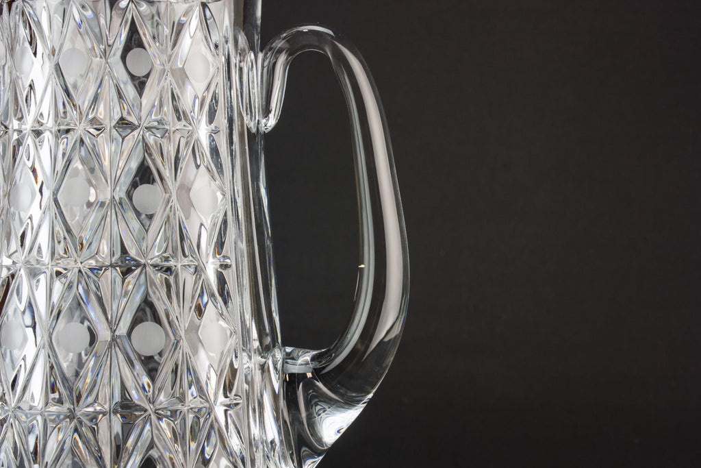 Tall glass water jug