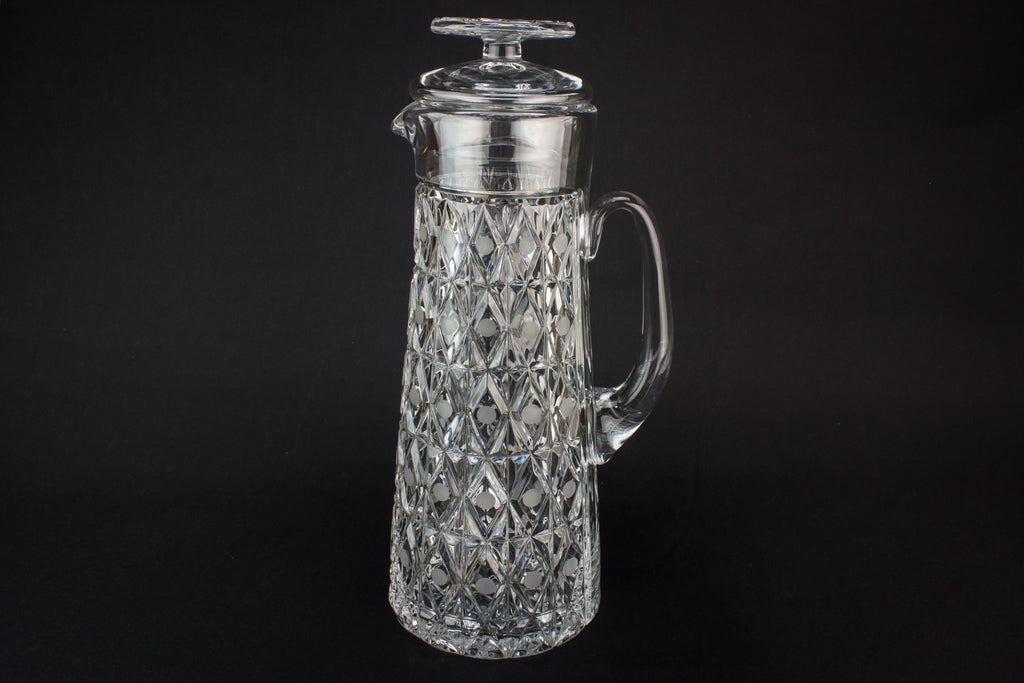 Tall glass water jug