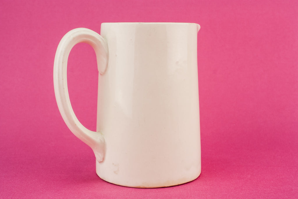 White pottery creamer