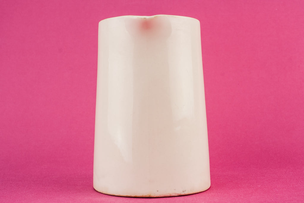 White pottery creamer