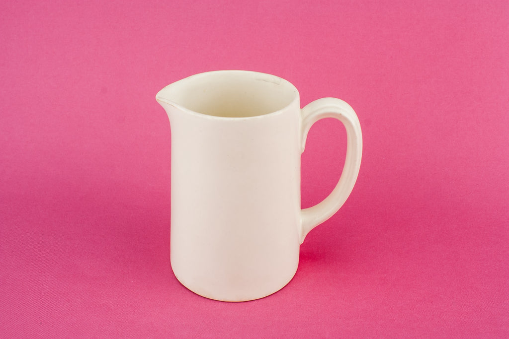 White pottery creamer