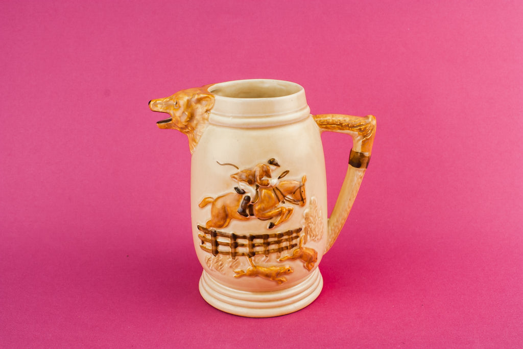 Orange pottery creamer