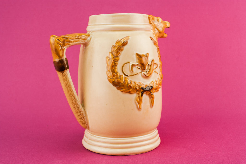 Orange pottery creamer