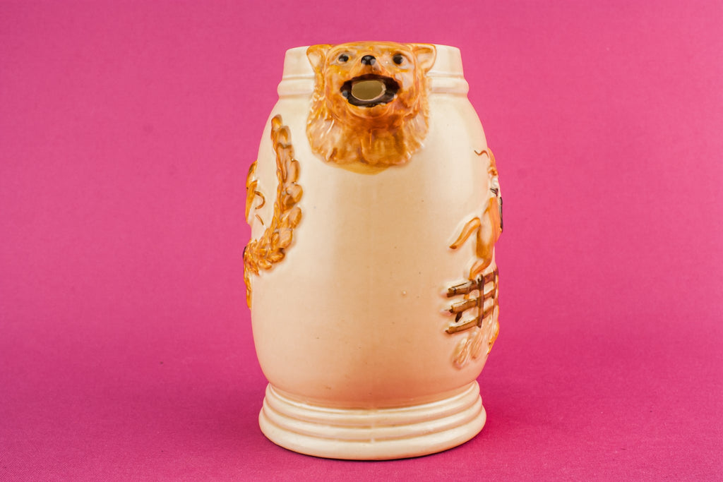 Orange pottery creamer