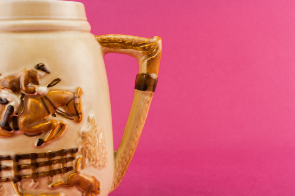Orange pottery creamer