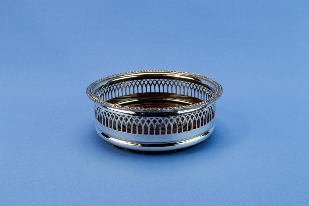 Silver plated bottle coaster, English mid 20th century