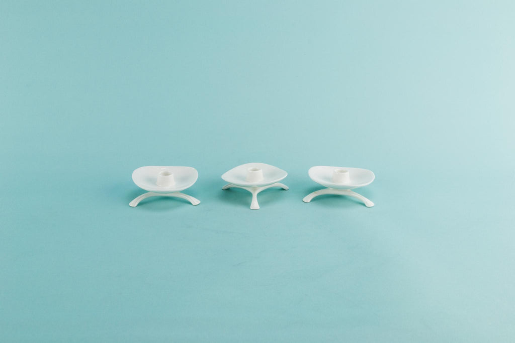 3 small white tripod candlesticks