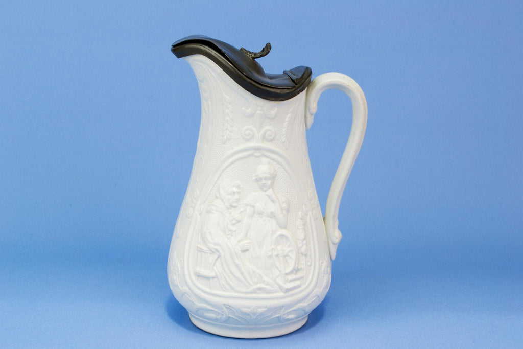 Tactile white ceramic jug with a lid, English 19th Century