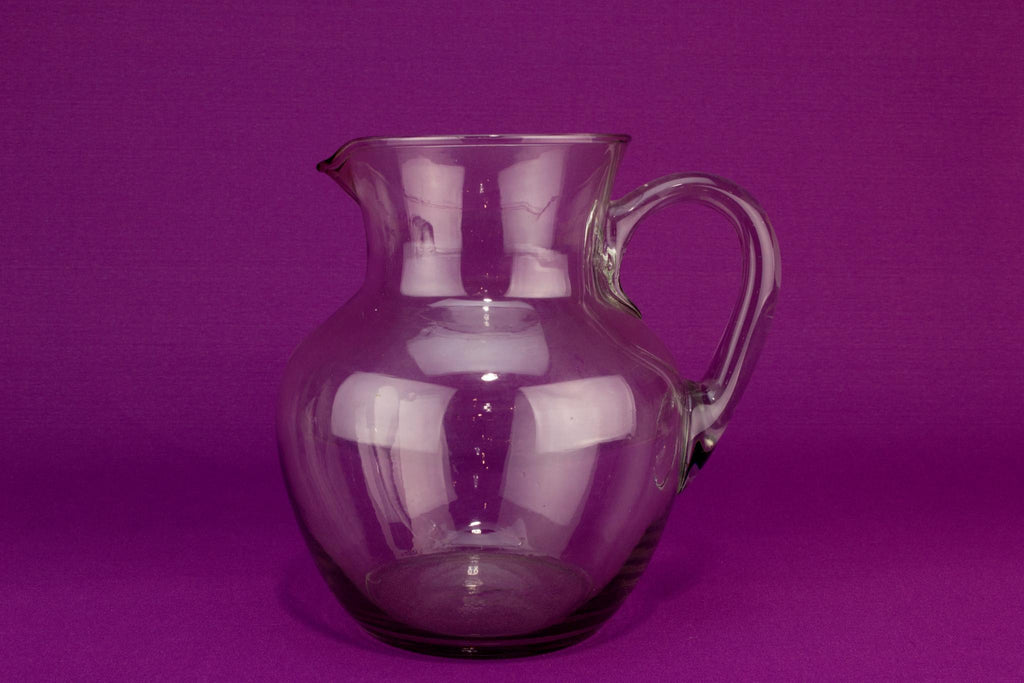 Globular blown glass water jug, English mid 20th century