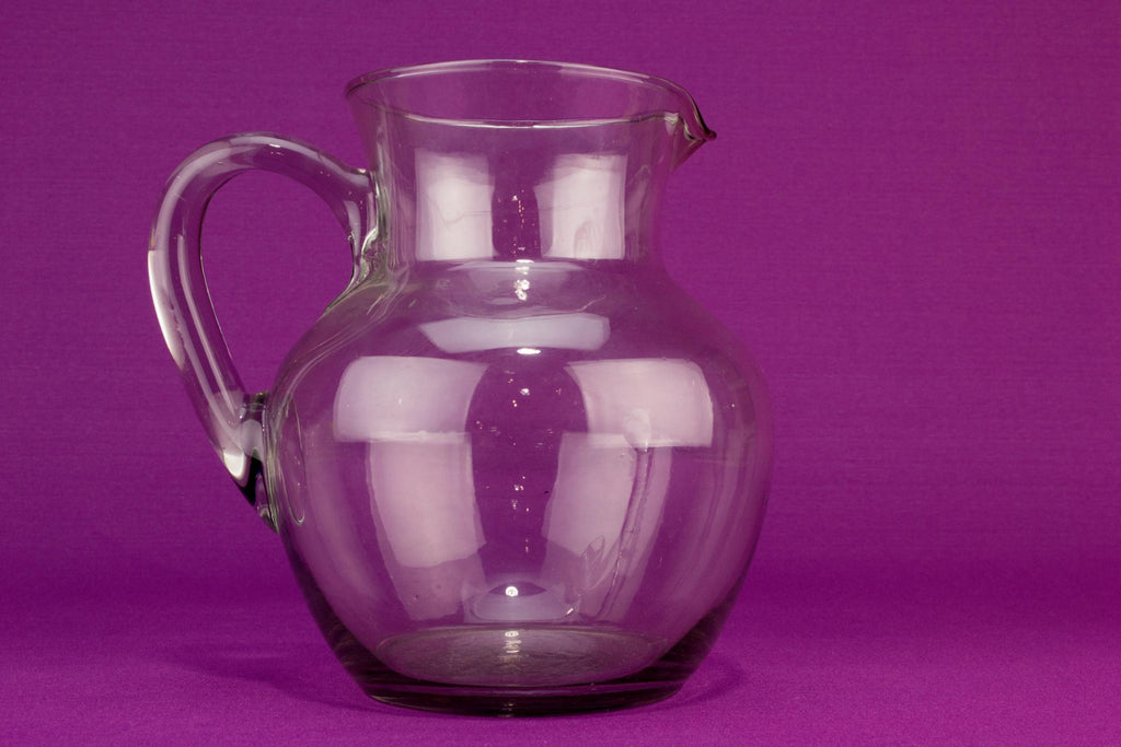 Globular blown glass water jug, English mid 20th century