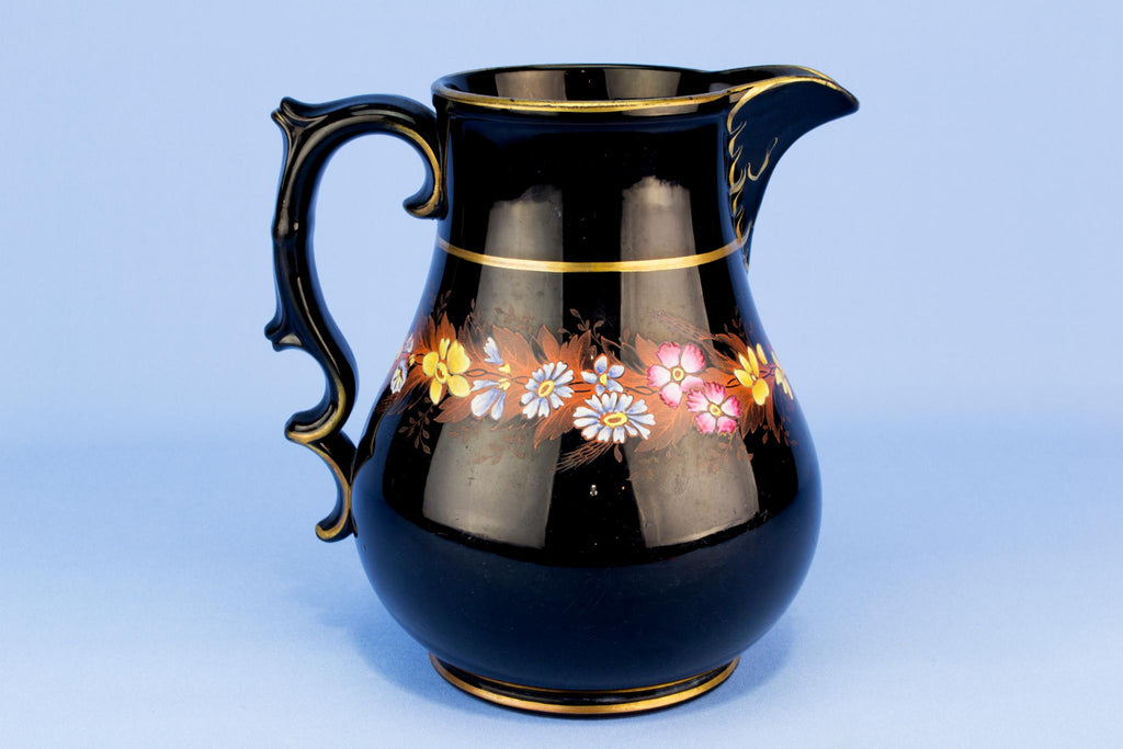 Black floral water jug, English 19th century