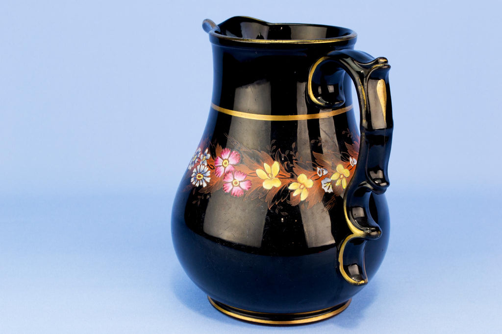 Black floral water jug, English 19th century