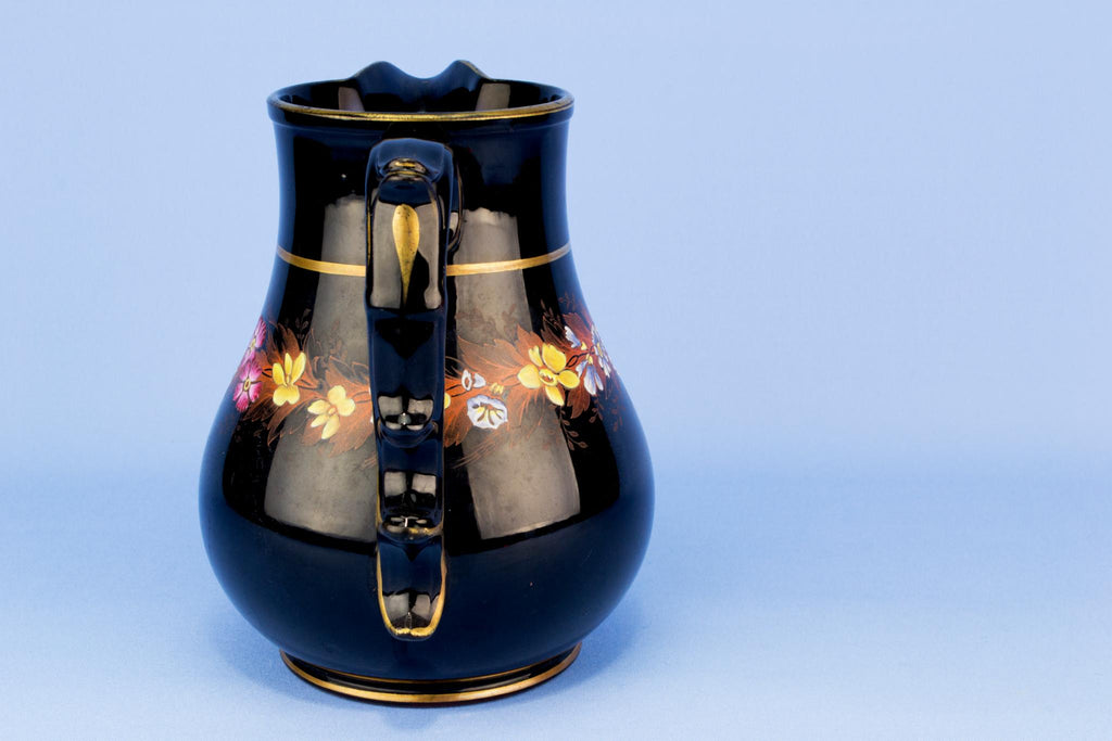 Black floral water jug, English 19th century