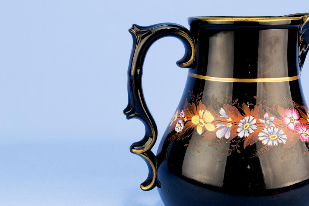 Black floral water jug, English 19th century