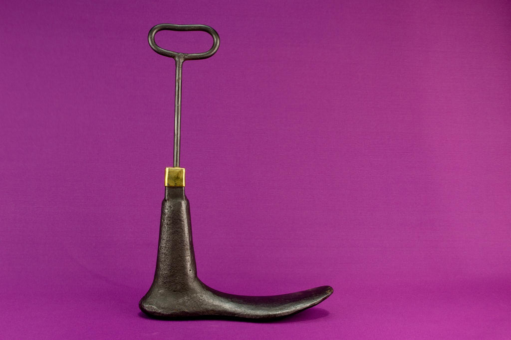 Boot shaped iron door stopper with a handle