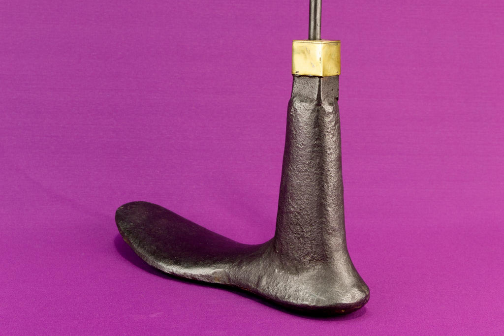 Boot shaped iron door stopper with a handle