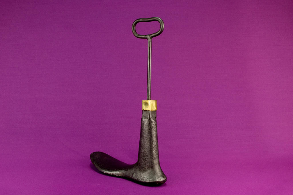 Boot shaped iron door stopper with a handle