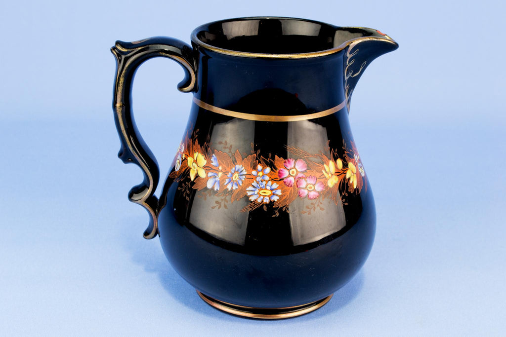 Medium black floral water jug, English 19th century