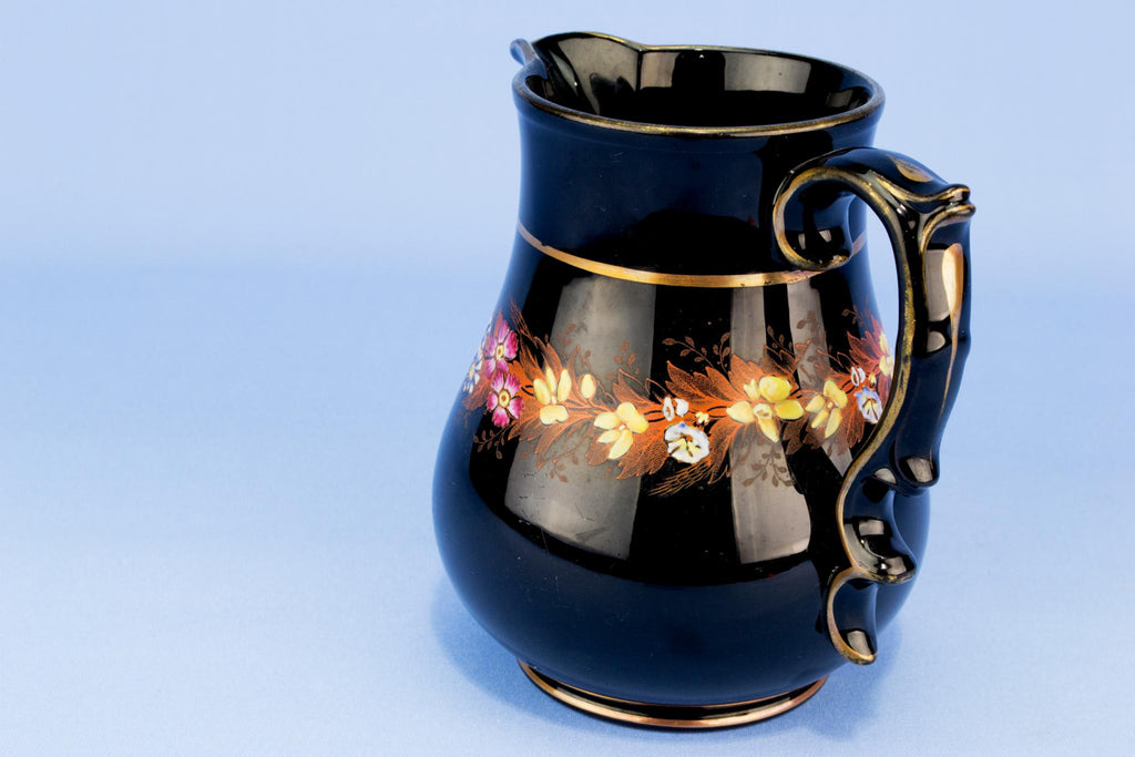 Medium black floral water jug, English 19th century