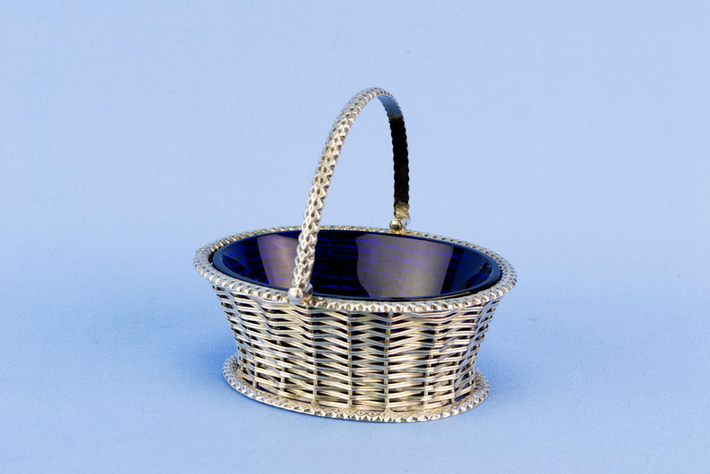 Basket shaped table condiment with blue glass liner