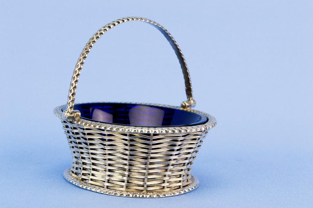 Basket shaped table condiment with blue glass liner