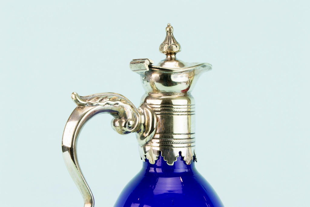Three Colourful Decanters Set on a Stand, English 19th Century