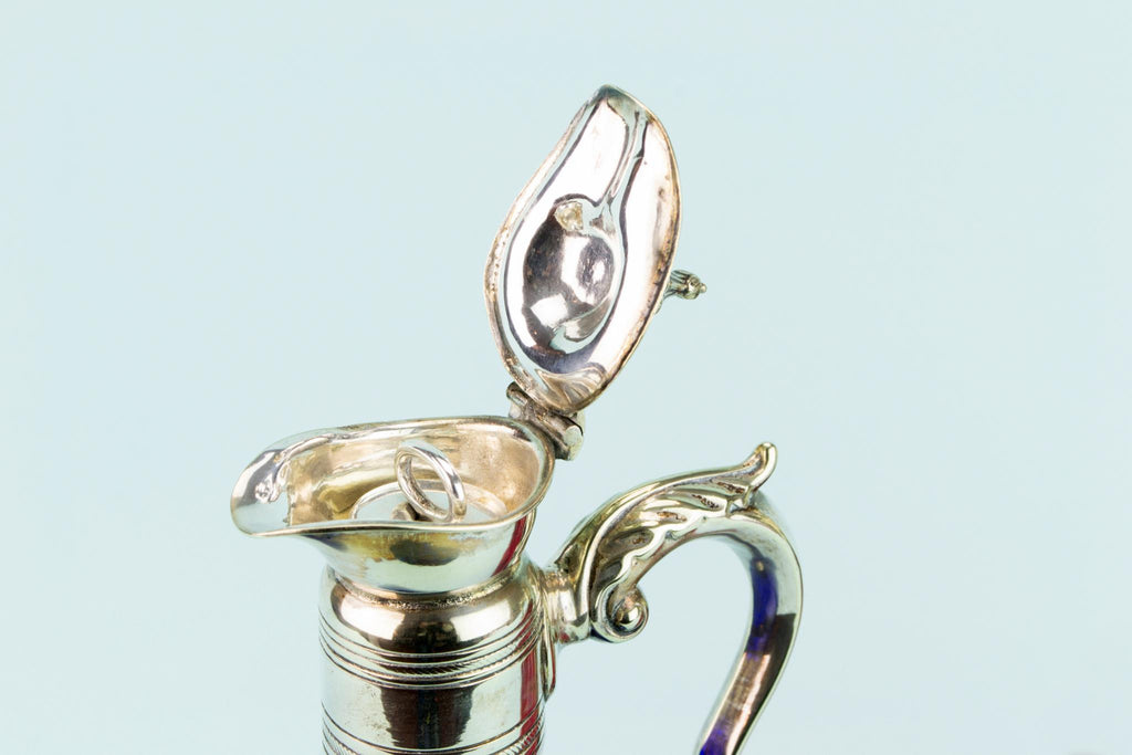 Three Colourful Decanters Set on a Stand, English 19th Century