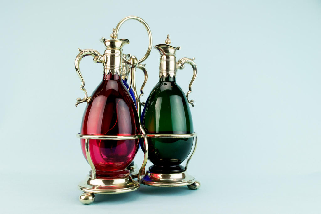 Three Colourful Decanters Set on a Stand, English 19th Century