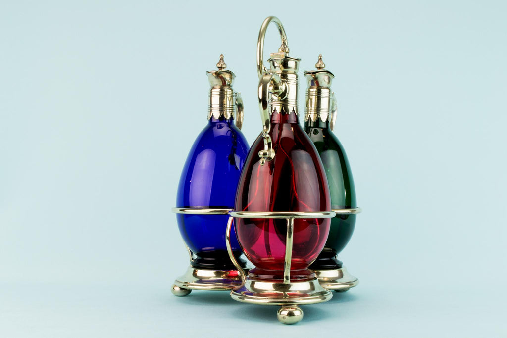 Three Colourful Decanters Set on a Stand, English 19th Century